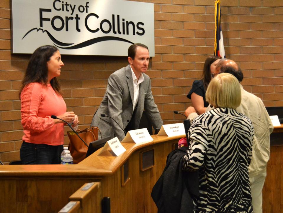 Candidates Andrea Booth, left, and Conor Duffy speak with community members following a Poudre School District Board of Education forum run by the League of Women Voters on Monday in the Fort Collins City Council Chambers in Fort Collins.