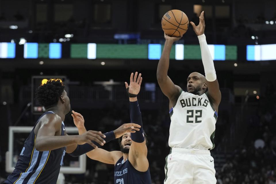 Milwaukee Bucks' Khris Middleton shoots past Memphis Grizzlies' David Roddy during the first half of a preseason NBA basketball game Friday, Oct. 20, 2023, in Milwaukee. (AP Photo/Morry Gash)