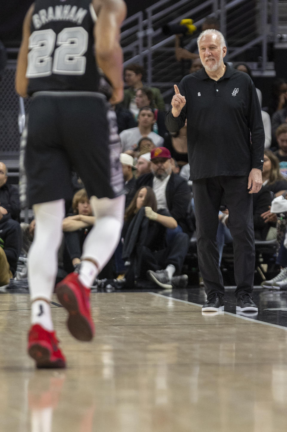 San Antonio Spurs head coach Gregg Popovich, right, speaks to his team as they compete against the Minnesota Timberwolves during the second half of an NBA basketball game, Saturday, April 8, 2023, in Austin, Texas. (AP Photo/Stephen Spillman)