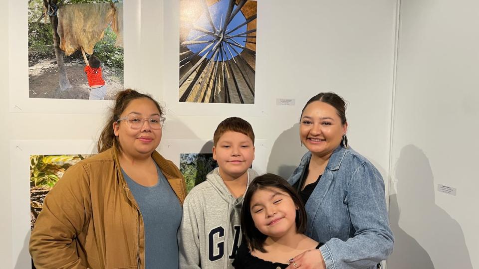 From left to right, Caroline Rabbitskin Sam, Connor Rabbitskin, Callie Sam and Shirleyann Rabbitskin. Family came to show their support on opening night. Shirleyann showed her cousin her photography. Shirleyann applied to the social change and solidarity at Dawson College for next year. 