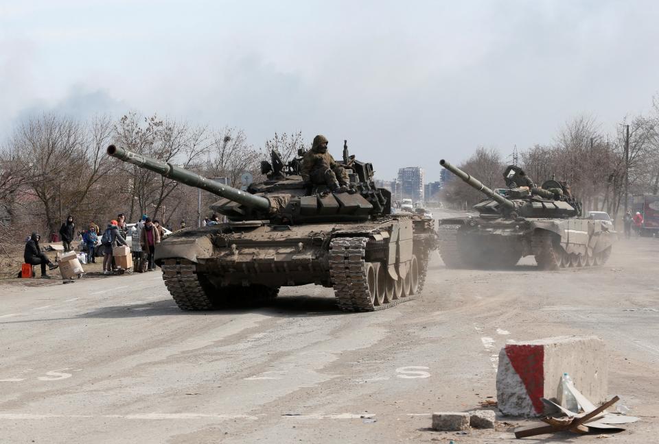 Pro-Russian troops on tanks (Alexander Ermochenko/Reuters)