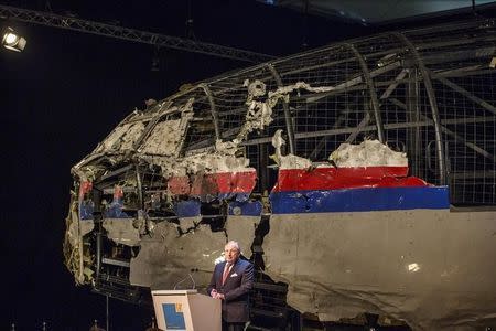 Tjibbe Joustra, chairman of the Dutch Safety Board, presents the final report into the crash of July 2014 of Malaysia Airlines flight MH17 over Ukraine in Gilze Rijen, the Netherlands, October 13, 2015. The Dutch Safety Board, issuing long-awaited findings on Tuesday of its investigation into the crash of a Malaysian passenger plane over eastern Ukraine, is expected to say it was downed by a Russian-made Buk missile but not say who was responsible for firing it. REUTERS/Michael Kooren