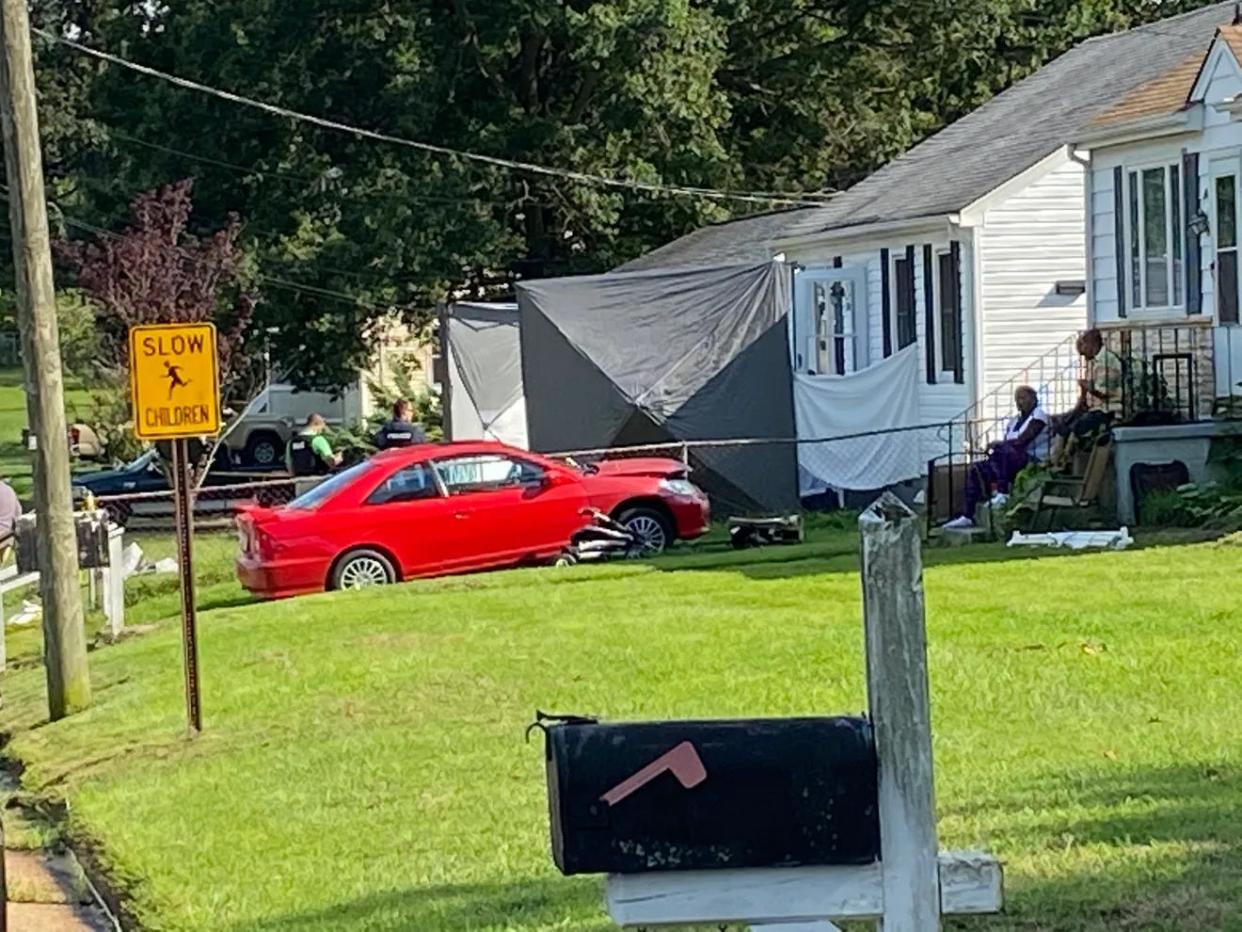 This file photo from Aug. 20, 2020, shows a shrouded double-murder scene at 1306 Central Ave. in Hopewell. Two people, Julian Sharpe and Elisa Scott, were killed there. One of the suspects in the case, 32-year-old Maurice Mulrain, is currently on trial in Hopewell.