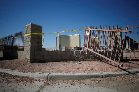 FILE PHOTO: A broken fence is pictured leading from the parking lot near the site of the Route 91 music festival mass shooting in Las Vegas, Nevada, U.S., October 5, 2017. REUTERS/Chris Wattie/File Photo