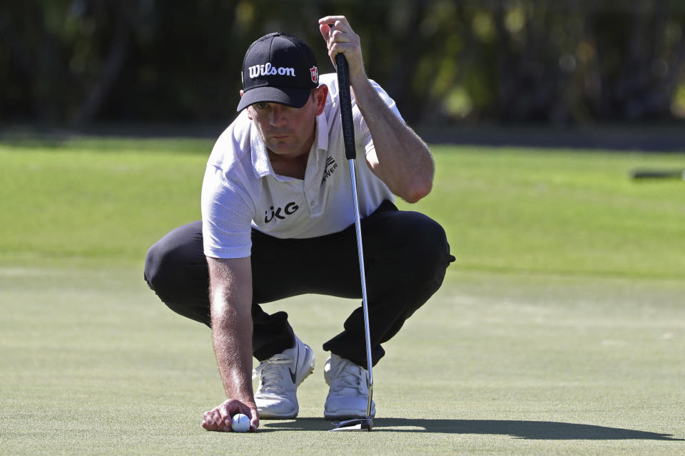 Brendan Steele lines up his putt on the ninth green during the third round at the Sony Open golf tournament Saturday, Jan. 16, 2021, in Honolulu. (AP Photo/Marco Garcia)