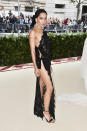 <p>Zoë Kravitz left little to the imagination in this risque Saint Laurent lace dress, which appeared to be held together by two pieces of fabric. Photo: Getty Images </p>