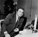 <p>A fresh faced and clean shaven Reynolds joins friends at an informal dinner party in Los Angeles in 1959. </p>