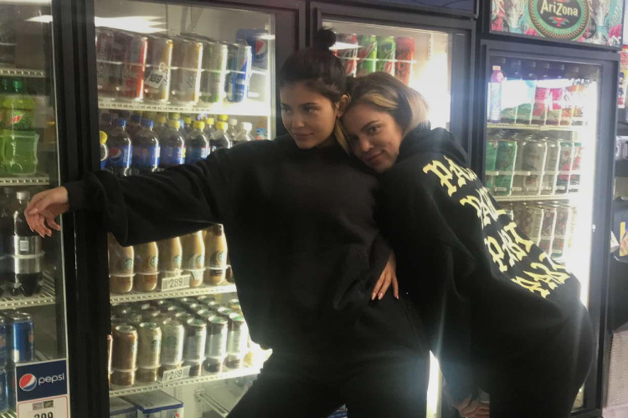 Kylie Jenner, left, seen with sister Khloé Kardashian, has been wearing baggy sweats ever since there’s been a rumor that she’s pregnant. (Photo: Snapchat/Kylie Jenner)