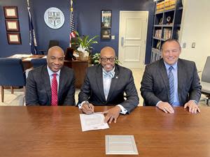 ODU President Brian O. Hemphill, Ph.D., (center) is shown with Sun Belt Conference Commissioner Keith Gill (left) and Arkansas State University Chancellor Kelly Damphousse, Ph.D., formally accepting the Sun Belt's invitation and officially signing on as a league member.