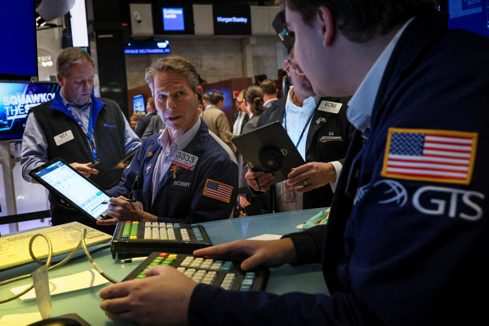 Traders work on the floor of the New York Stock Exchange (NYSE) in New York City, U.S., December 7, 2022.  REUTERS/Brendan McDermid