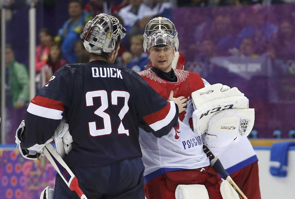 Team USA's goalie Jonathan Quick (L) talks with Russia's goalie Sergei Bobrovski after Team USA defeated Russia in a shootout in their men's preliminary round ice hockey game at the 2014 Sochi Winter Olympics, February 15, 2014. REUTERS/Jim Young (RUSSIA - Tags: OLYMPICS SPORT ICE HOCKEY)