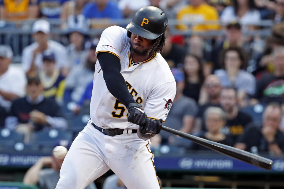 Pittsburgh Pirates' Josh Bell drives in a run with an RBI single off Milwaukee Brewers starting pitcher Jhoulys Chacin during the first inning of a baseball game in Pittsburgh, Friday, May 31, 2019. (AP Photo/Gene J. Puskar)