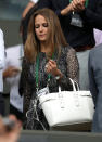 <p>Clad in a printed Burberry dress, Andy Murray’s wife continued to show support for the tennis pro on day eight of Wimbledon. <i>[Photo: PA Images]</i></p>