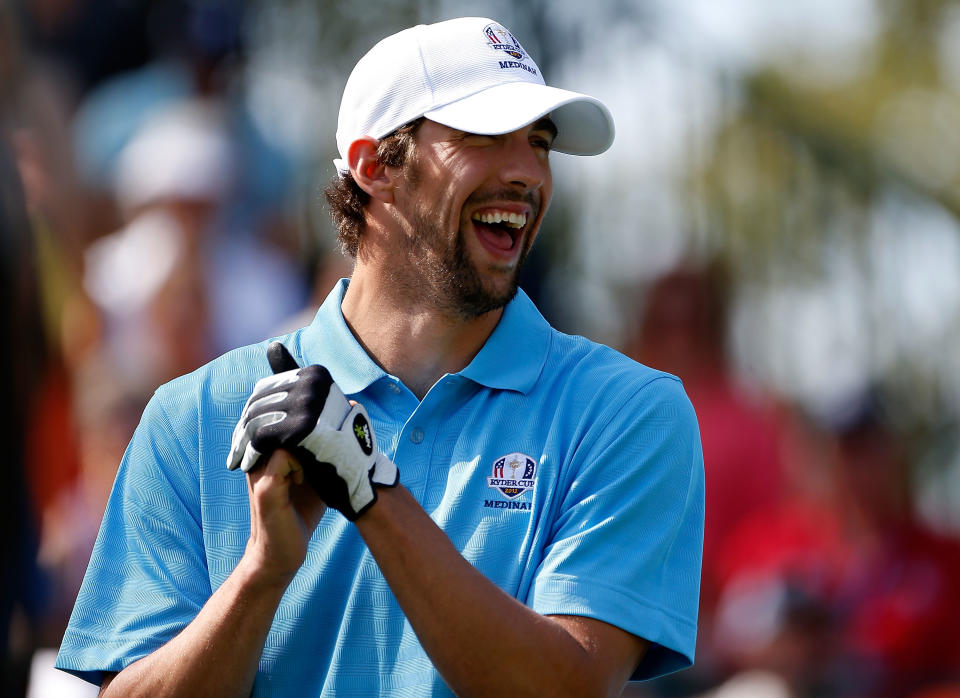 MEDINAH, IL - SEPTEMBER 25: Olympic champion Michael Phelps smiles on the first tee during the 2012 Ryder Cup Captains & Celebrity Scramble at Medinah Country Golf Club on September 25, 2012 in Medinah, Illinois. (Photo by Jamie Squire/Getty Images)