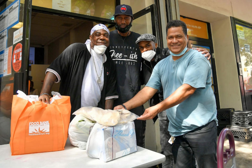 <p>Tracy Morgan, Leroy Williams and Ruperto Vanderpool volunteer at the Food Bank for New York City's Community Kitchen & Food to distribute essentials to families in need on Saturday.</p>