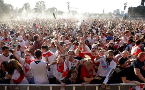 England fans go wild in Hyde Park as their team takes the lead against Croatia - Credit: Matt Dunham / AP