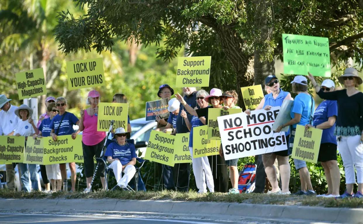 Protesters rally against gun violence and in support of certain gun restrictions along U.S. 41 in Sarasota.