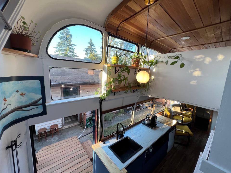 The view of the renovated bus's interiors from the staircase.