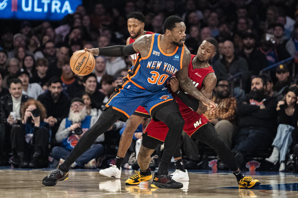 New York Knicks forward Julius Randle (30) posts up as Miami Heat guard Terry Rozier (2) defends during the first half of an NBA basketball game on Saturday, Jan. 27, 2024, in New York. (AP Photo/Peter K. Afriyie)