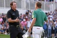 Mar 4, 2018; Mexico City, MEX; Phil Mickelson (left) and Justin Thomas shake hands following the final round of the WGC - Mexico Championship golf tournament at Club de Golf Chapultepec. Orlando Ramirez-USA TODAY Sports