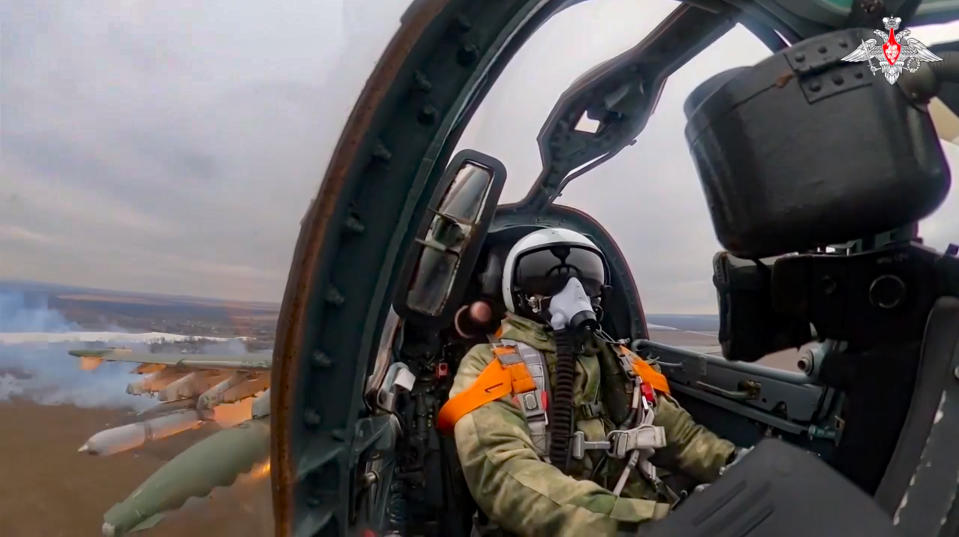 In this handout photo taken from video and released by Russian Defense Ministry Press Service on Wednesday, March 15, 2023, A Su-25 ground attack jet of the Russian air force fires rockets on a mission over Ukraine. (Russian Defense Ministry Press Service via AP)