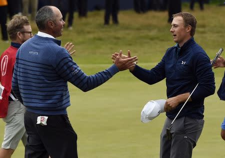 Jul 23, 2017; Southport, ENG; Jordan Spieth (right) shakes hands with Matt Kuchar on the 18th green after winning The 146th Open Championship golf tournament at Royal Birkdale Golf Club. Mandatory Credit: Ian Rutherford-USA TODAY Sports