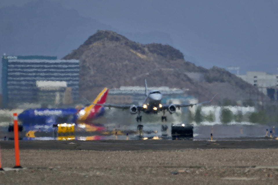 A jet takes flight as heat ripples radiate from the runway, Tuesday, July 25, 2023 at Sky Harbor International Airport, in Phoenix. Phoenix this month shattered its record for consecutive days in which the temperature reached at least 110 degrees Fahrenheit (43 Celsius), standing at 26 days and counting as of Tuesday. (AP Photo/Matt York)