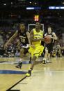 Michigan guard Caris LeVert (23) drives the ball during the first half of a second round NCAA college basketball tournament game against the Wofford Thursday, March 20, 2014, in Milwaukee. (AP Photo/Morry Gash)