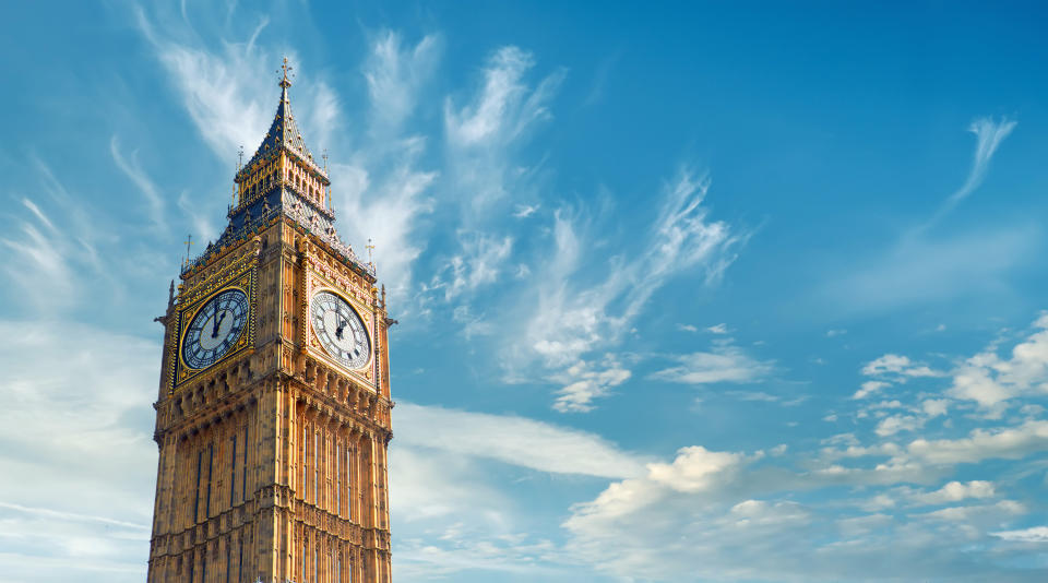 A spired building with a large clockface