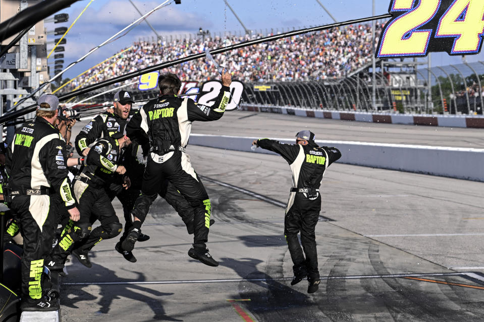 The pit crew of William Byron celebrates after winning a NASCAR Cup Series auto race at Darlington Raceway, Sunday, May 14, 2023, in Darlington, S.C. (AP Photo/Matt Kelley)