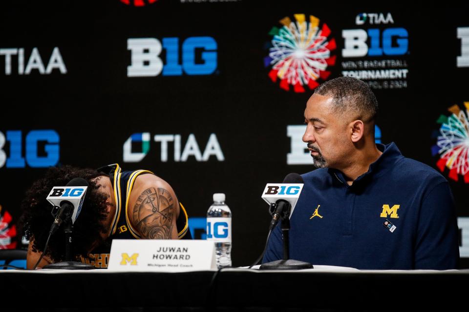Michigan head coach Juwan Howard looks at forward Terrance Williams II during the post game press conference after First Round loss to Penn State at the Big Ten tournament at Target Center in Minneapolis, Minn. on Wednesday, March 13, 2024.