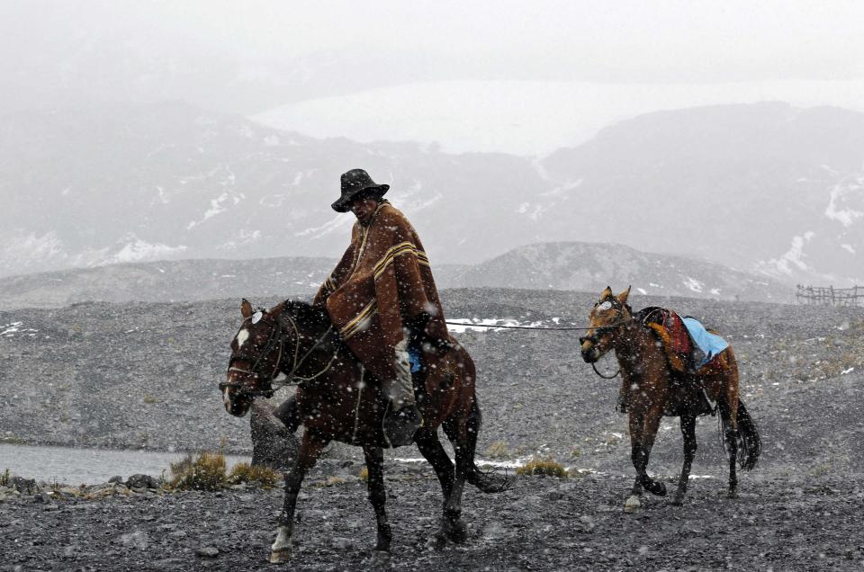 An assistant guide returns from the Pastoruri glacier along the Climate Change Route in Huaraz