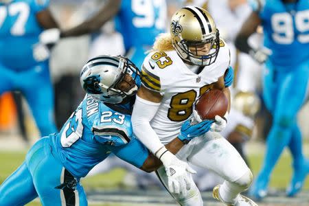 Nov 17, 2016; Charlotte, NC, USA; New Orleans Saints wide receiver Willie Snead (83) gets tackled by Carolina Panthers defensive back Leonard Johnson (23) in the third quarter at Bank of America Stadium. The Panthers defeated the Saints 23-20. Mandatory Credit: Jeremy Brevard-USA TODAY Sports