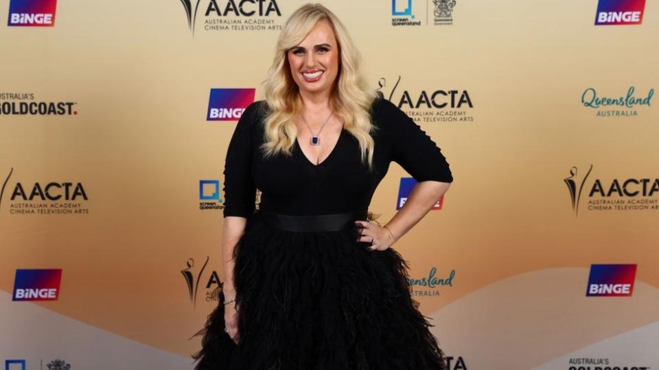 Rebel Wilson in a black dress