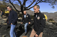 From left, California Governor Gavin Newsome, L.A. City Councilman Mike Bonin, and L.A. City Mayor Eric Garcetti tour a burned home along Tigertail Road in Brentwood, Calif., Tuesday Oct. 29, 2019. (Wally Skalij/Los Angeles Times via AP, Pool)