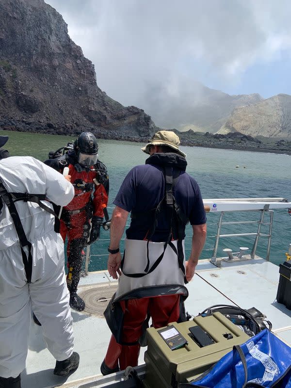 Members of a dive squad conduct a search during a recovery operation around White Island, which is also known by its Maori name of Whakaari, a volcanic island that fatally erupted earlier this week, in New Zealand