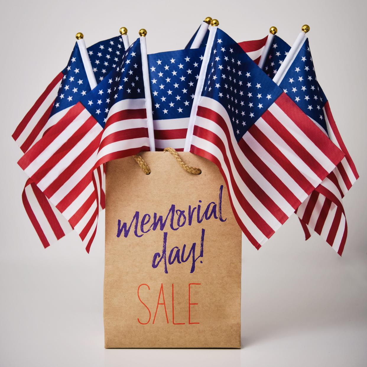 bag with US flags that say Memorial Day Sale