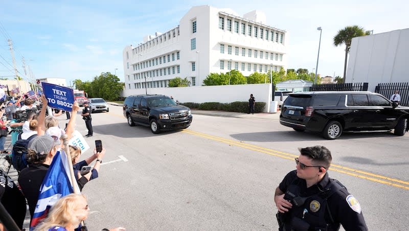 Supporters cheer as the motorcade carrying former President Donald Trump arrives at the Federal Courthouse on Friday, March 1, 2024, in Fort Pierce, Fla.