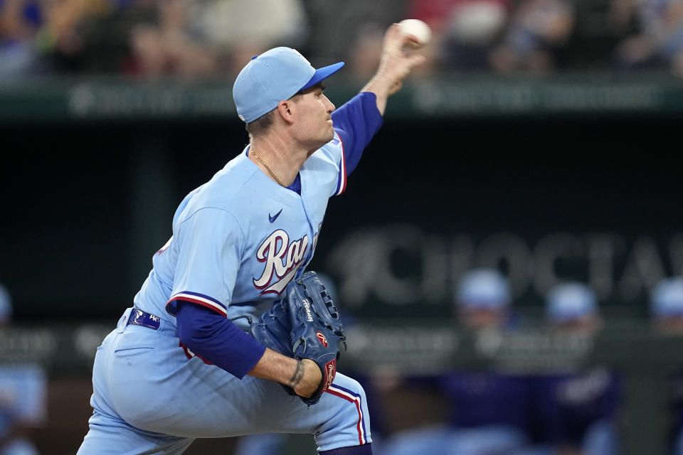 Texas Rangers relief pitcher Andrew Heaney throw to the Oakland Athletics in the fourth inning of a baseball game, Sunday, Sept. 10, 2023, in Arlington, Texas. (AP Photo/Tony Gutierrez)