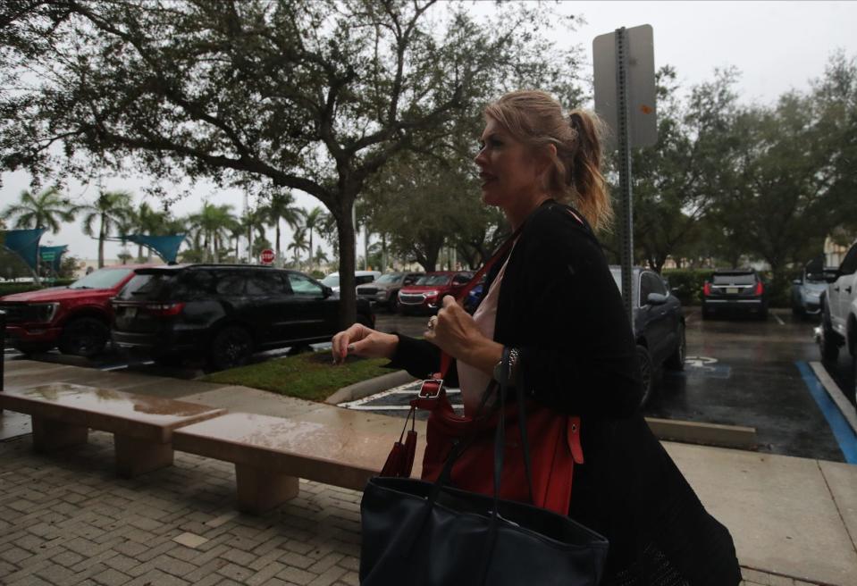 Cape Coral council member Patty Cummings makes her way to City Hall to participate in the council meeting Wednesday, Nov. 15, 2023. After an ongoing investigation by the State AttorneyÕs Office Cummings turned herself in to authorities on Tuesday, Nov. 14, 2023 after being charged with three felonies.