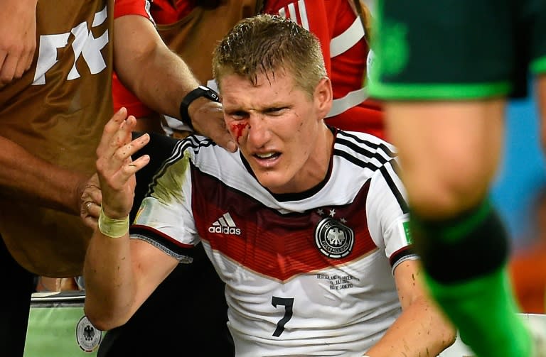 Germany midfielder Bastian Schweinsteiger is hurt after a clash during the 2014 World Cup final in Brazil