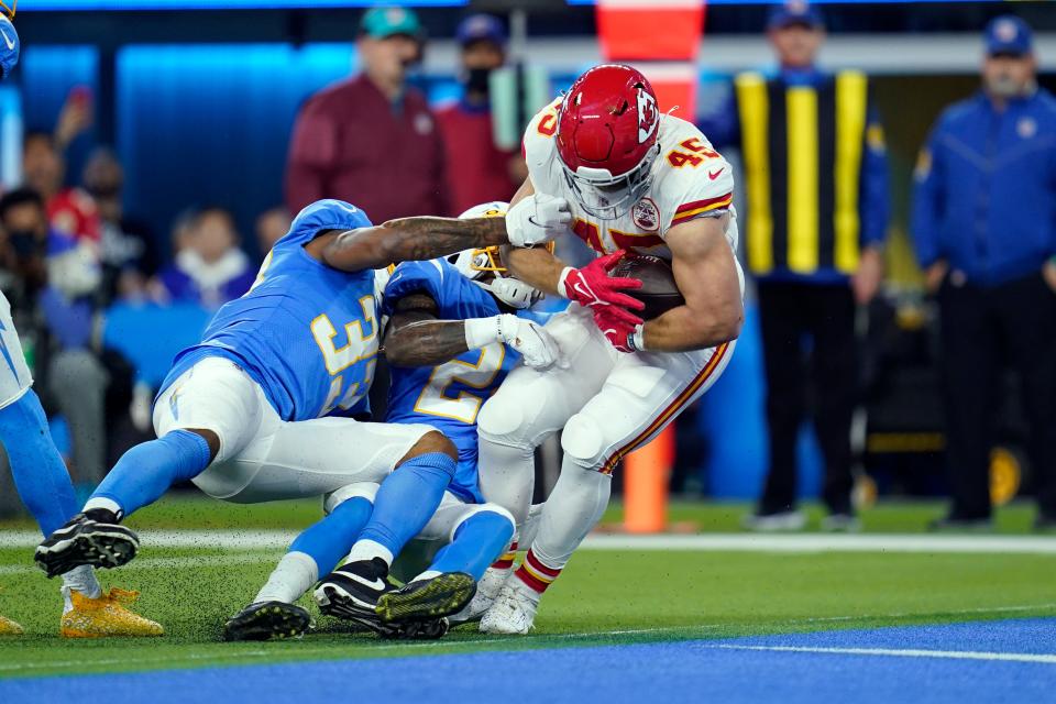 Kansas City Chiefs fullback Michael Burton scores a touchdown during the first half of an NFL football game against the Los Angeles Chargers on Dec. 16, 2021, in Inglewood, Calif. In the past two decades the fullback become nearly extinct, as teams grapple with roster limits and salary cap restraints that force general managers to value players that can do a little bit of everything. (AP Photo/Ashley Landis, File)