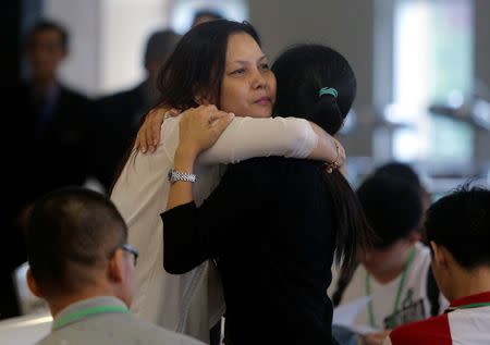 Family members arrive for an MH370 briefing in Putrajaya, Malaysia, July 30, 2018. REUTERS/Sadiq Asyraf