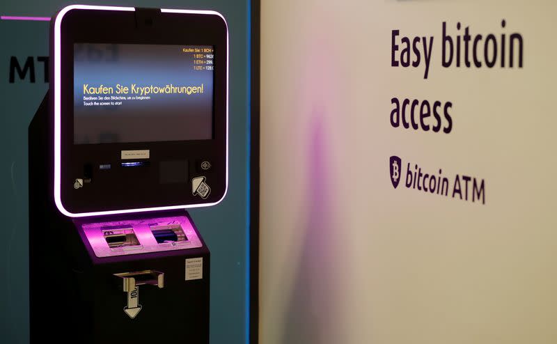 FILE PHOTO: "Buy cryptocurrencies" is seen on the display of a cryptocurrency ATM at the headquarters of Swiss Falcon Private Bank in Zurich