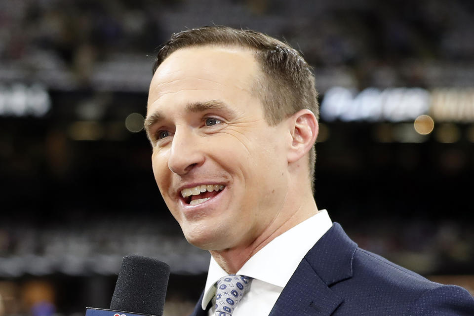 FILE - NBC Sports commentator and former New Orleans Saints quarterback Drew Brees speaks from the field before an NFL football game between the Saints and the Buffalo Bills, Thursday, Nov. 25, 2021, in New Orleans. Purdue athletic director Mike Bobinski announced Brees would return to the campus in West Lafayette, Indiana, as an assistant coach to help the Boilermakers prepare for their Jan. 2 Citrus Bowl game against No. 17 LSU. (AP Photo/Tyler Kaufman, File)