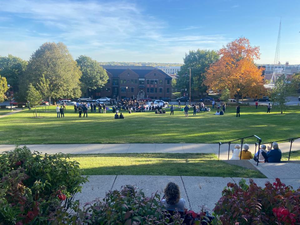 People gather at Hoyt Sherman Place in Des Moines for the lawn enhancement project ribbon cutting ceremony on Oct. 17, 2023.