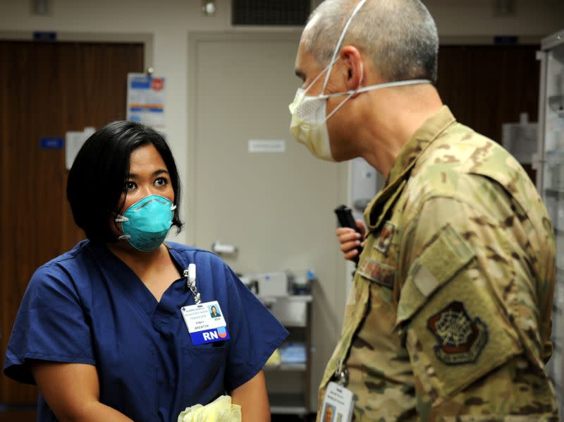 U.S. Air Force Major Pinky Brewton discusses hospital procedures at Dameron Hospital in Stockton
