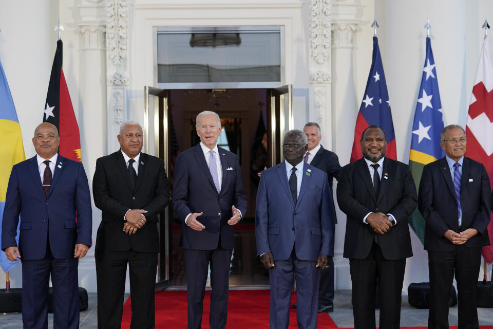 President Joe Biden, third from left, speaks as he poses for photos with Pacific Island leaders on the North Portico of the White House in Washington, Thursday, Sept. 29, 2022. From left, Micronesia President David Panuelo, Fiji Prime Minister Josaia Voreqe Bainimarama, Biden, Solomon Islands Prime Minister Manasseh Sogavare, Papua New Guinea Prime Minister James Marape, and Marshall Islands President David Kabua. (AP Photo/Susan Walsh)