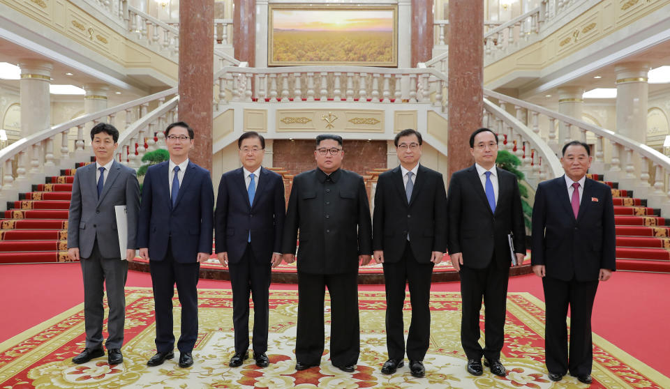 In this Wednesday, Sept. 5, 2018 photo provided on Thursday, Sept. 6, 2018 by South Korea Presidential Blue House via Yonhap News Agency, North Korean leader Kim Jong Un, center, poses for a photograph with members of South Korean delegation headed by National Security Director Chung Eui-yong, third from left, and Kim Yong Chol, a North Korean senior ruling party official and former intelligence chief, right, in Pyongyang, North Korea. A South Korean delegation met with North Korean leader Kim Jong Un on Wednesday during a visit to arrange an inter-Korean summit planned for this month and help rescue faltering nuclear diplomacy between Washington and Pyongyang. (South Korea Presidential Blue House/Yonhap via AP)