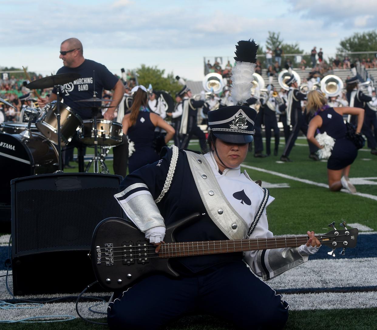 Granville senior Nina Petersheim shreds on the bass guitar to Metallica's "Enter Sandman" before GHS's home opener against Clear Fork on Friday, Aug. 26, 2022. The pregame show included special guest drummer Granville Schools Superintendent Jeff Brown. The district received the best scores in Licking County on the recently released state report cards.